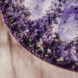 Art pieces made with Shallow Cast Epoxy Resin. Purple Pigments and stones.