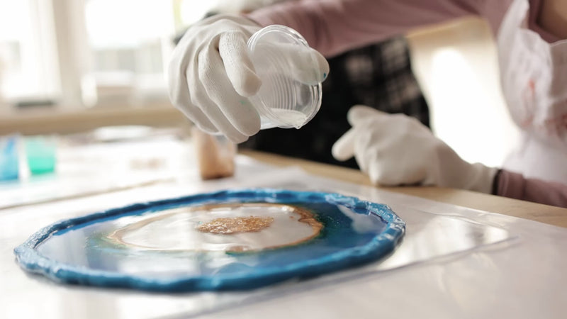 Shallow Casting Resin Being Poured Into A Disc