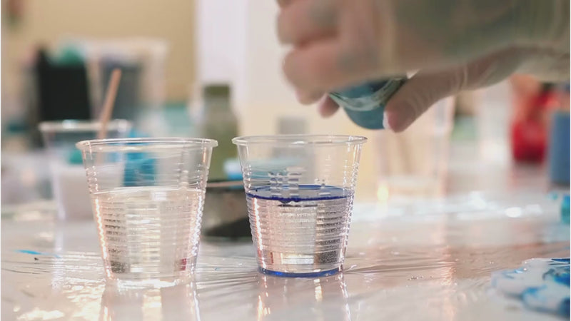 Blue Pigment Paste Being Put Into Resin 